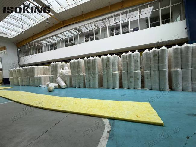 Unrolled yellow glass wool insulation blanket showing soft texture and high thermal resistance