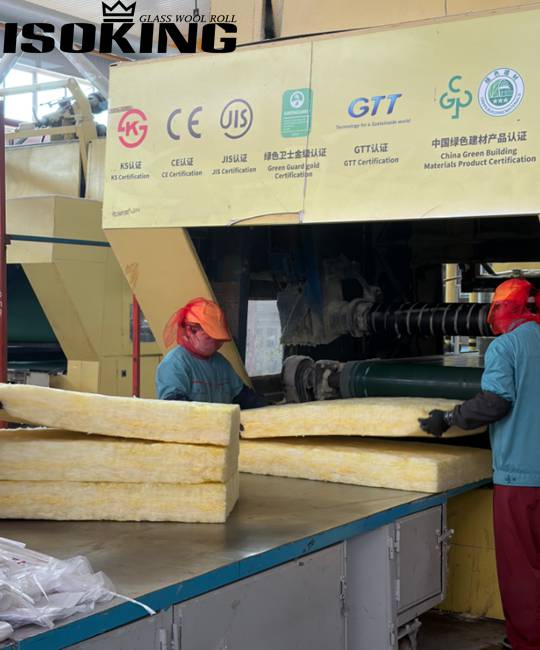 Large warehouse filled with IKING yellow glass wool batt insulation products, organized inventory management, industrial insulation materials prepared for global construction projects